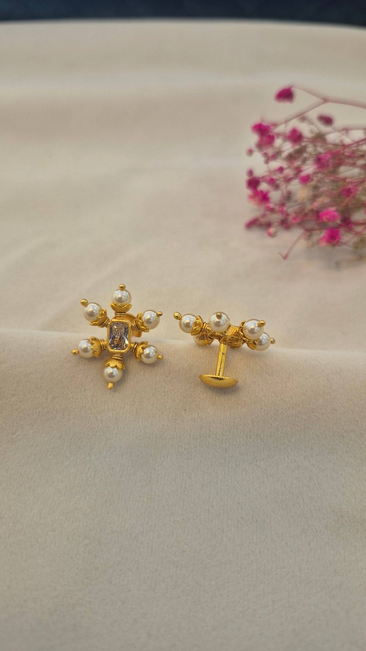 Pearl stud with center white rectangular stone