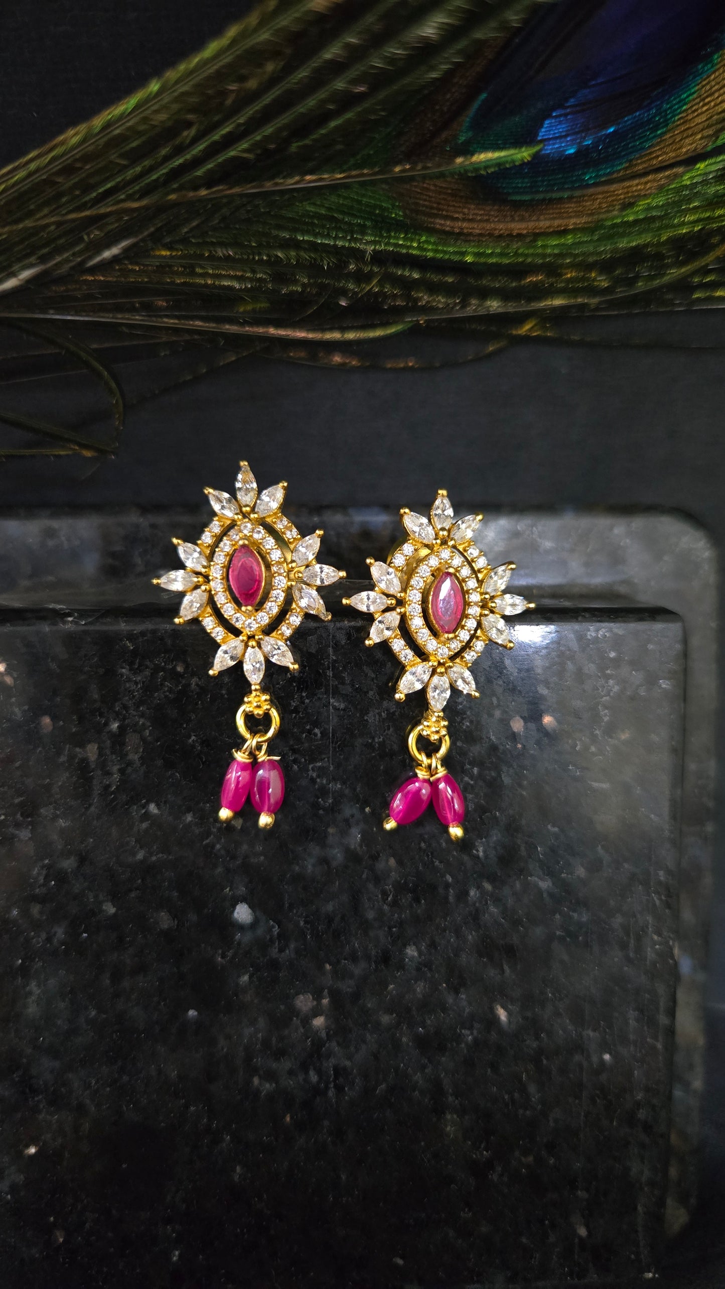 Zircon stone studs with red stone