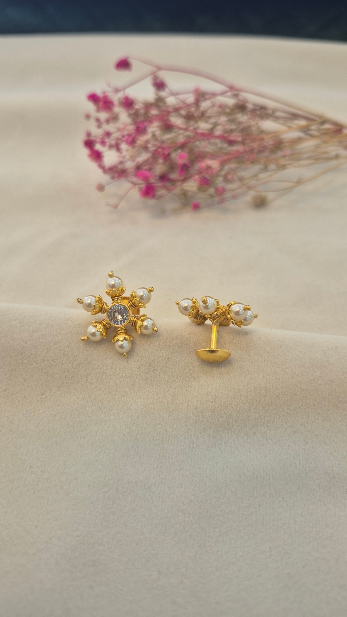 Pearl stud with center white round stone