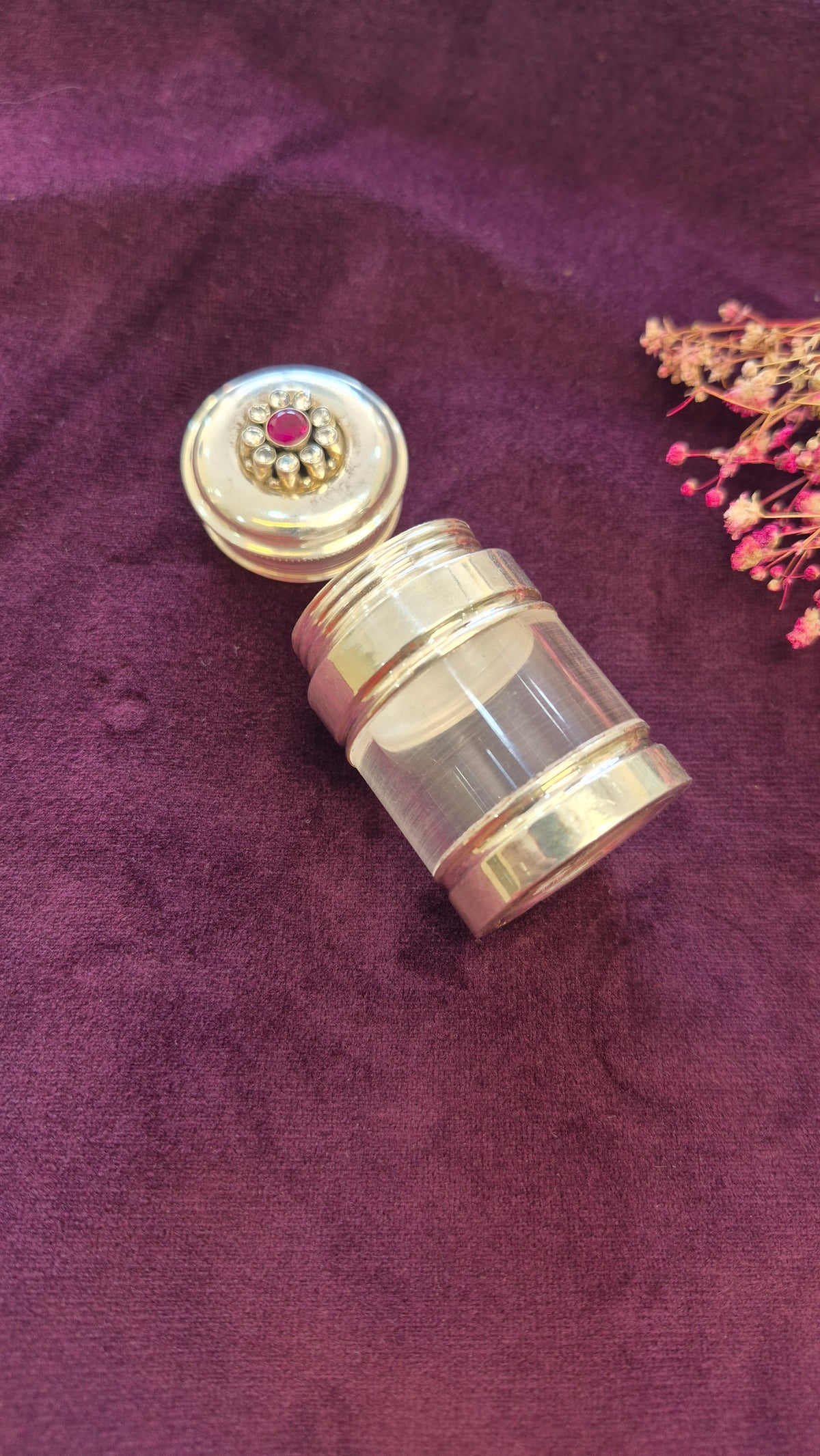 Kumkum, karpura box or multi utility silver box with red cut stone work.