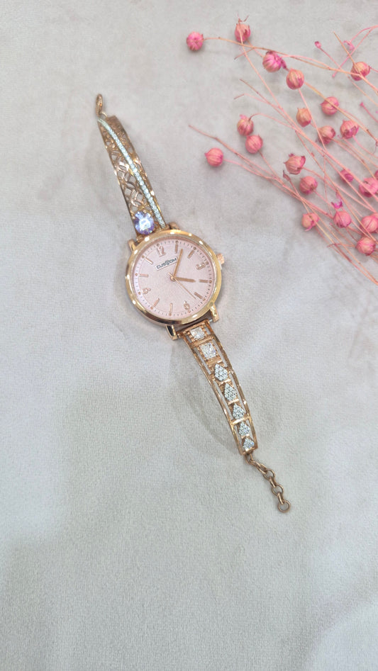 Rose gold watch with pink dial