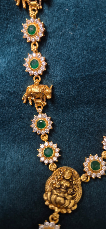 Stone necklace with cow and calf detailing