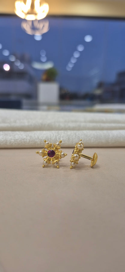 Pearl studs with red stone