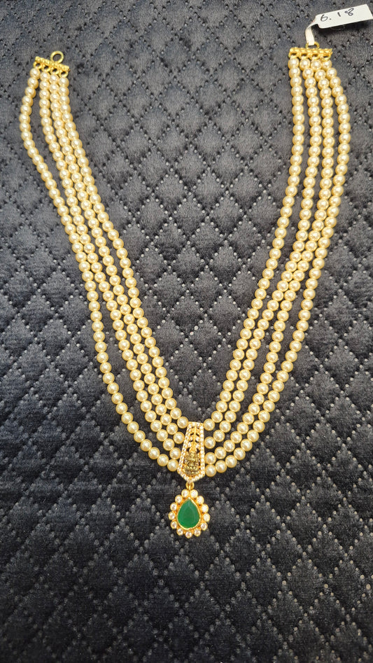 4 layer Short Necklace in pearls with Green stones and Lakshmi motiff