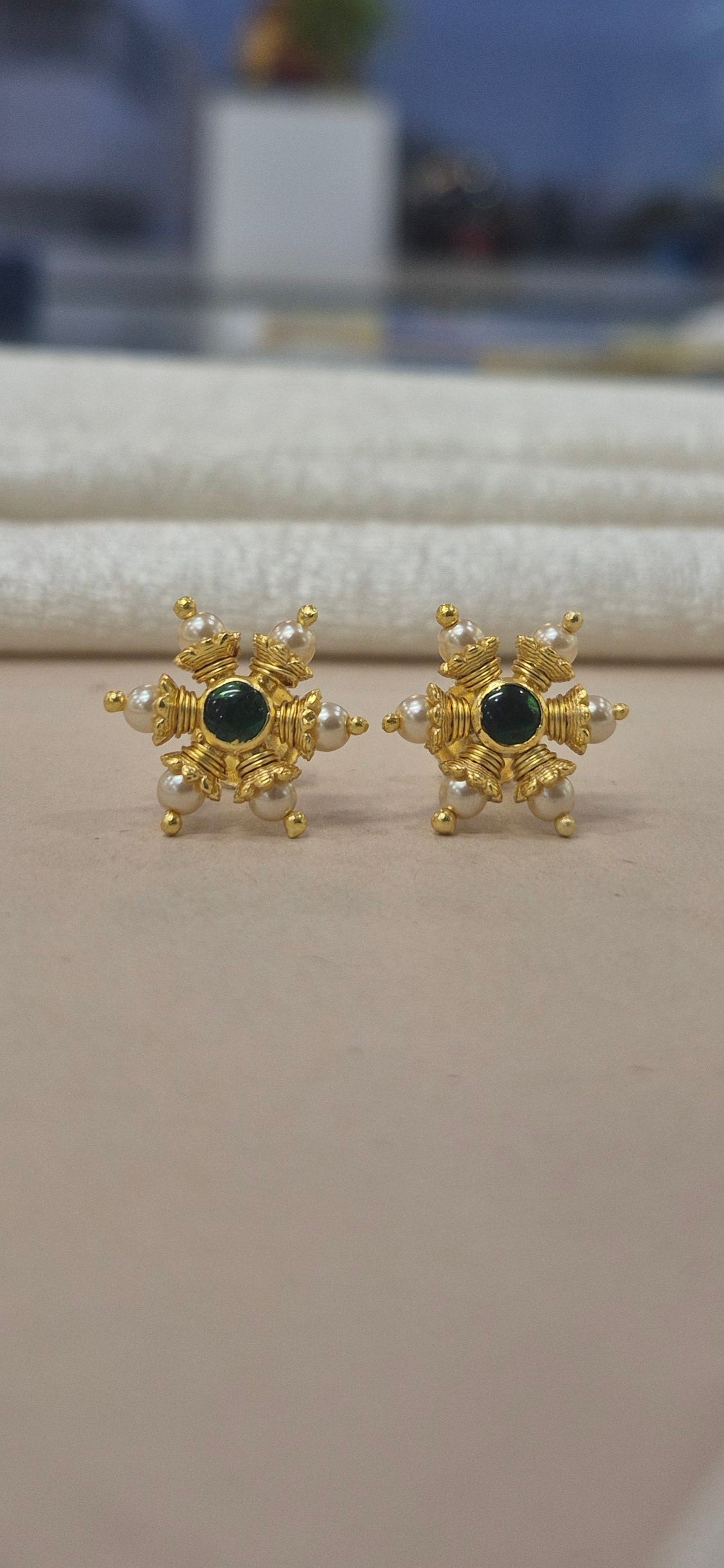 Pearl stud with center green stone