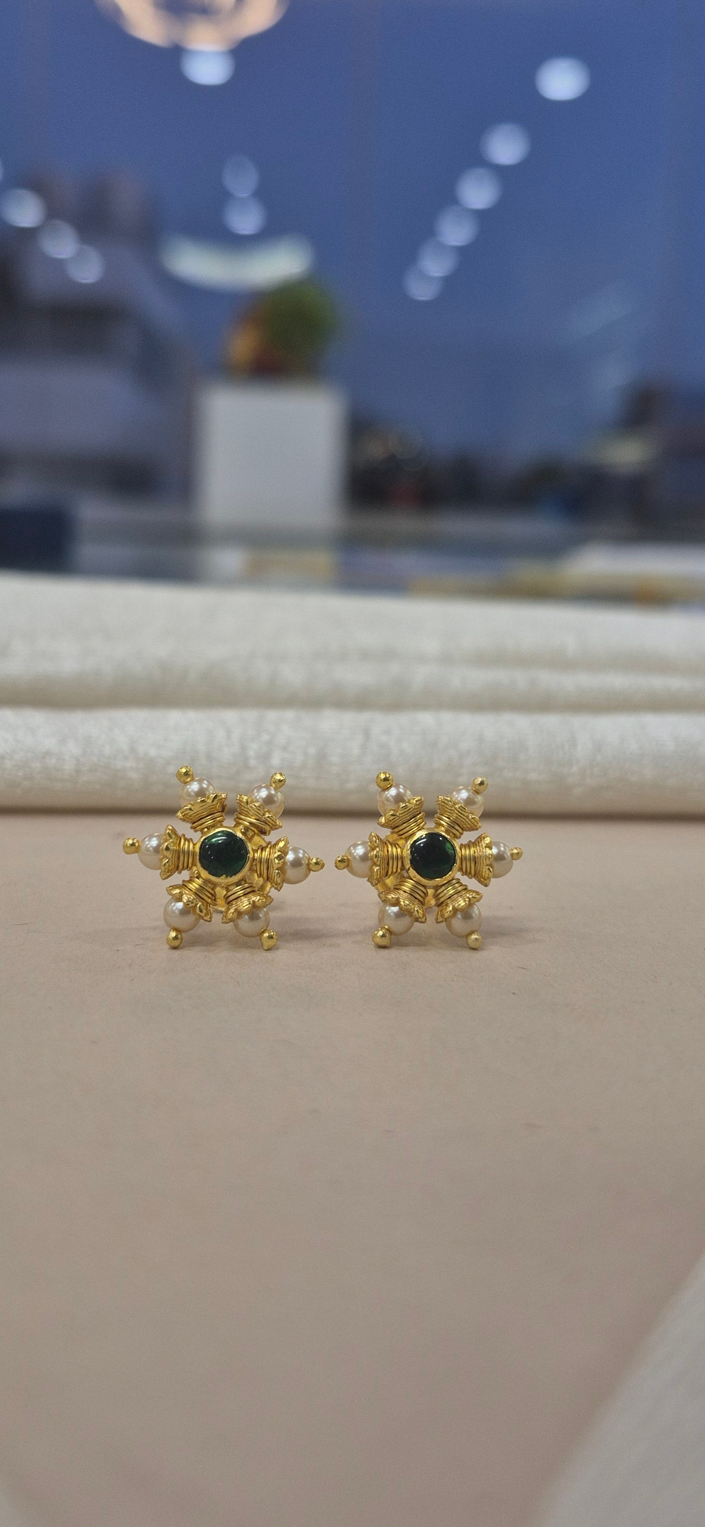 Pearl stud with center green stone