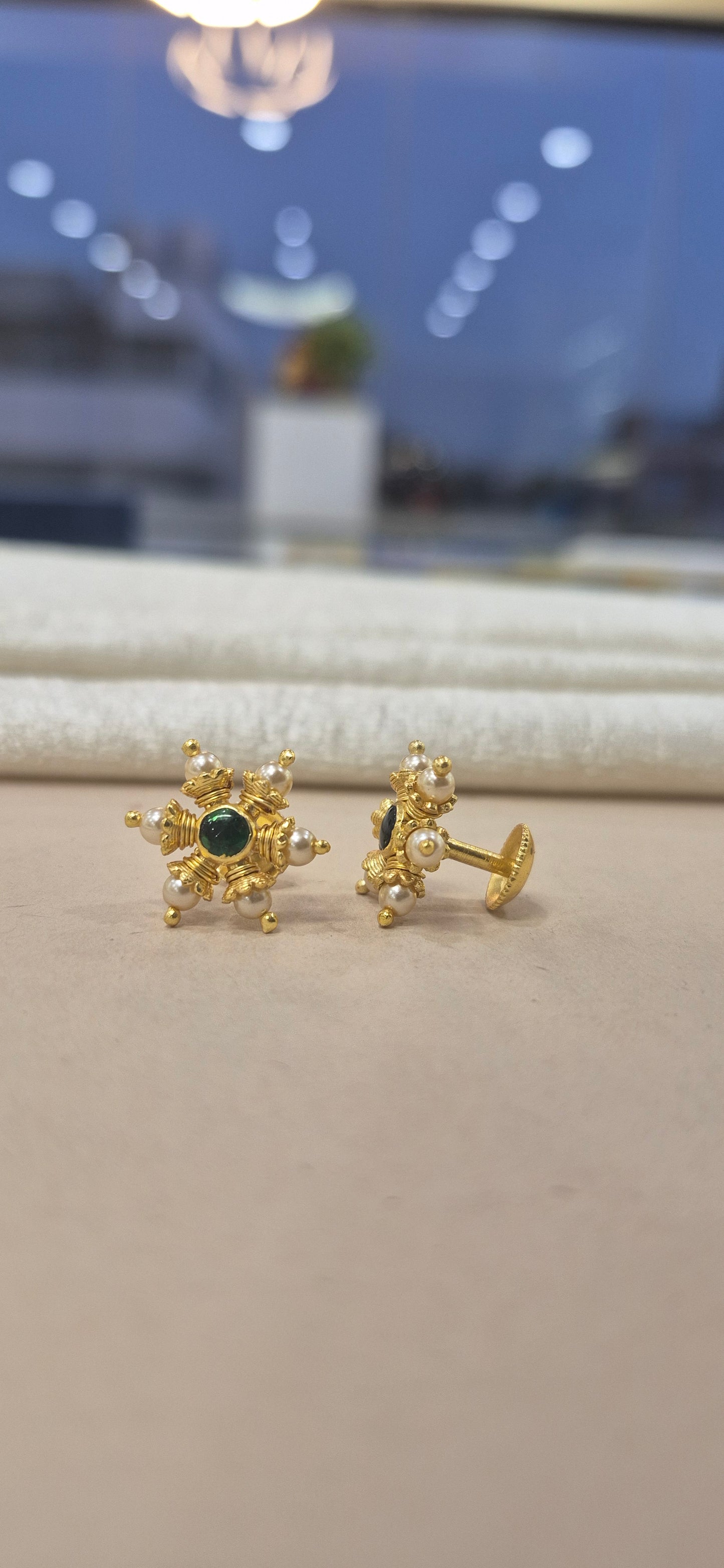 Pearl stud with center green stone