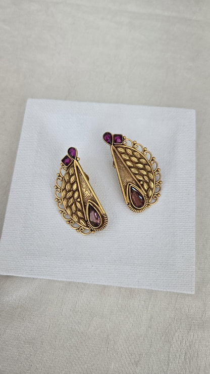 Contemporary studs with purple semiprecious stones