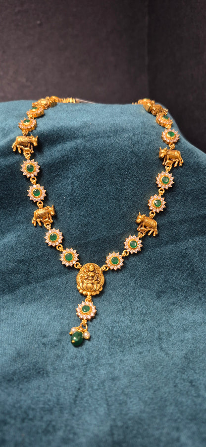Stone necklace with cow and calf detailing