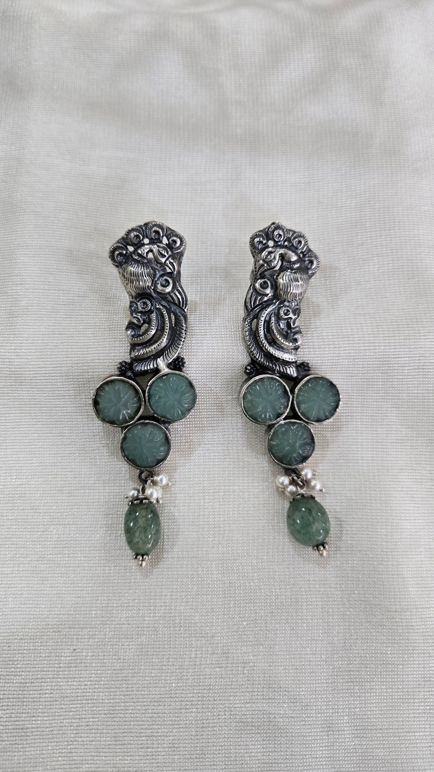 Peacock motifs silver studs