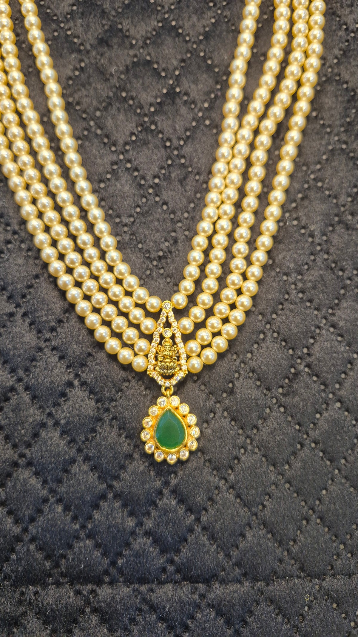 4 layer Short Necklace in pearls with Green stones and Lakshmi motiff