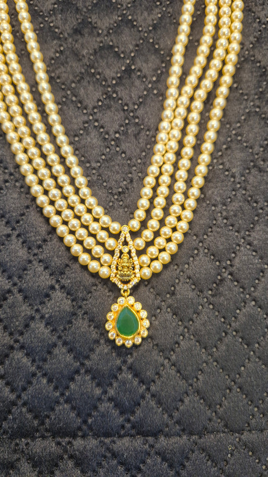 4 layer Short Necklace in pearls with Green stones and Lakshmi motiff