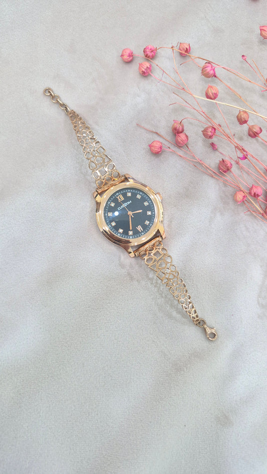 Rose gold watch with black dial