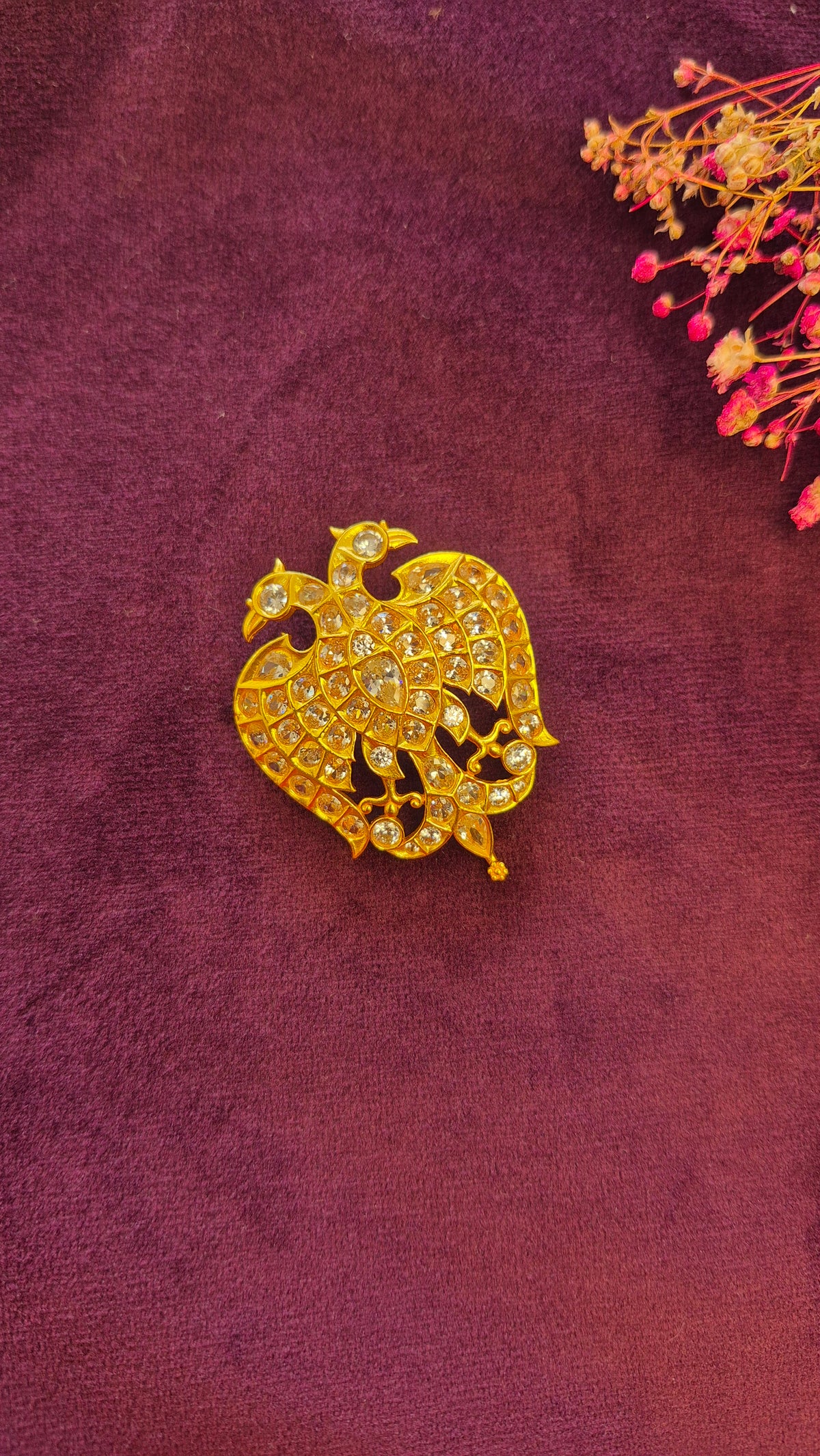 Ganda berunda pendant on white stones