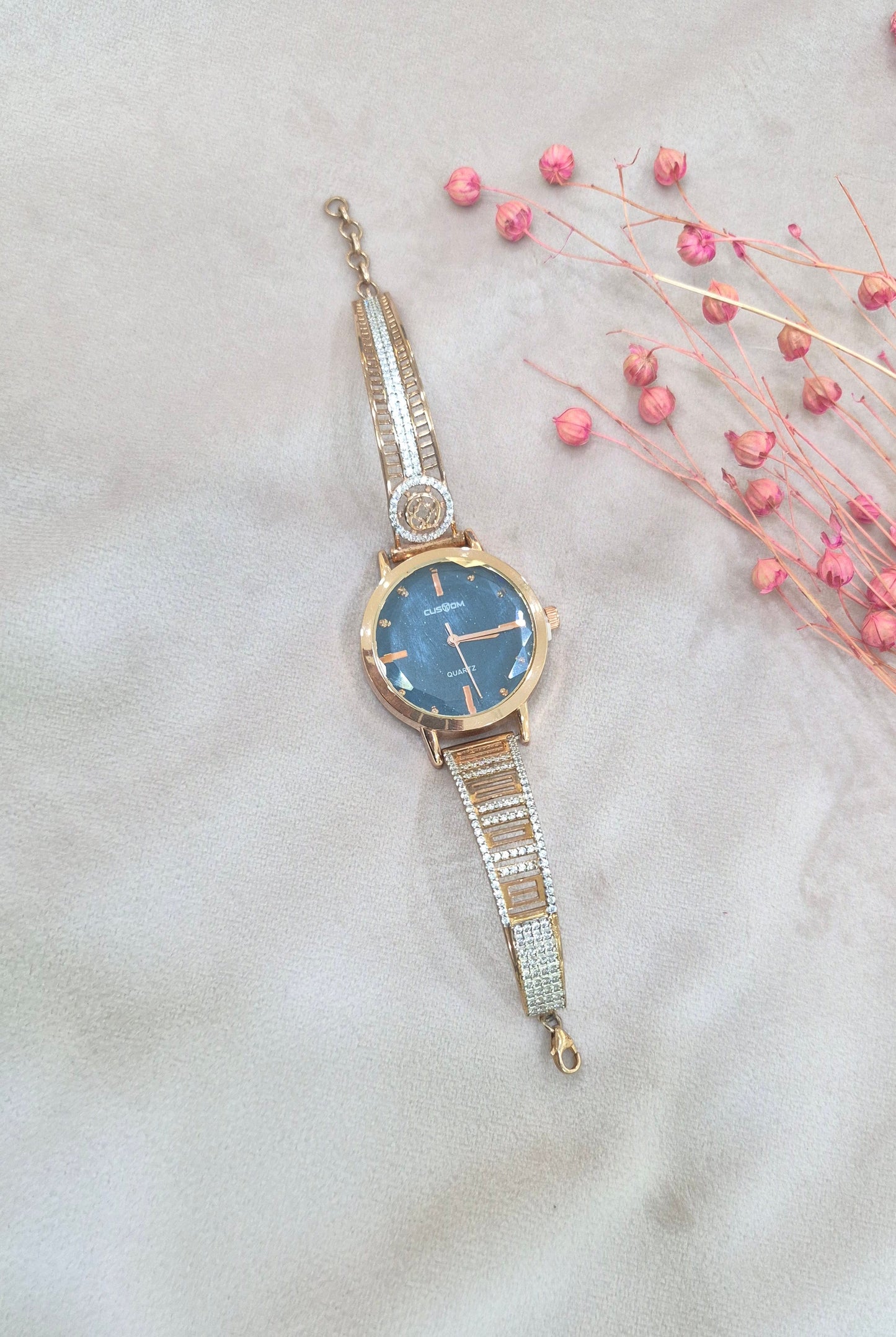 Rose gold watch with blue dail