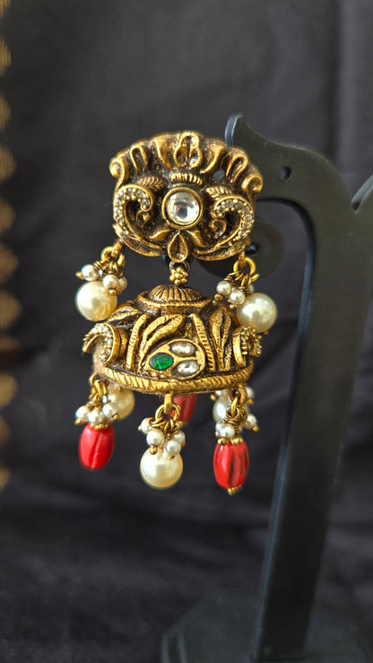 Deep Nakas with Kundan and polki studded jhumka with coral drops