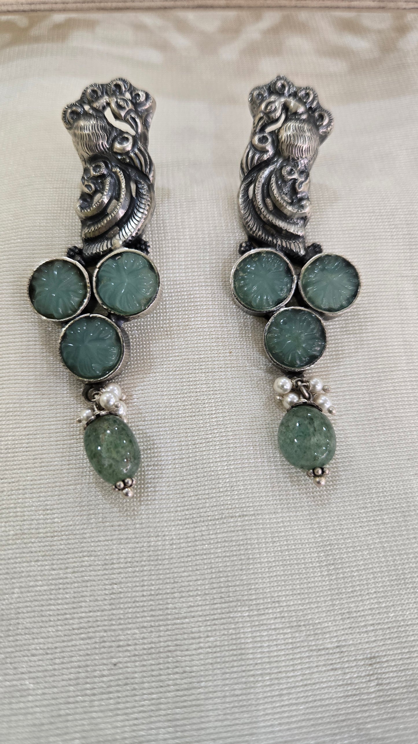Peacock motifs silver studs
