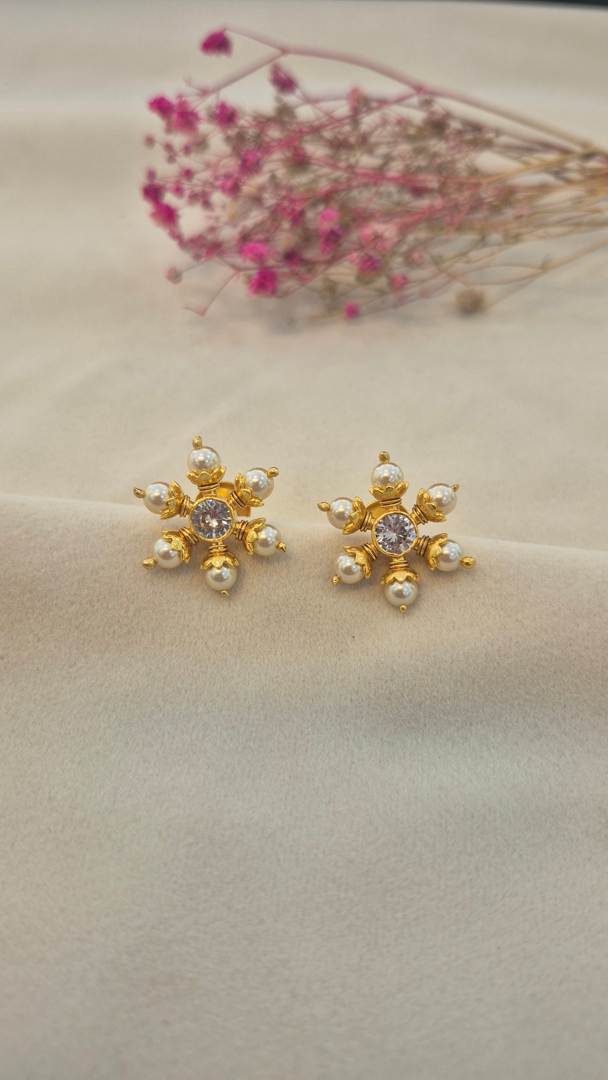 Pearl stud with center white round stone