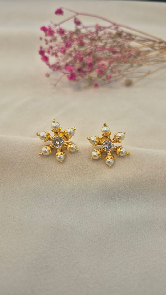 Pearl stud with center white round stone