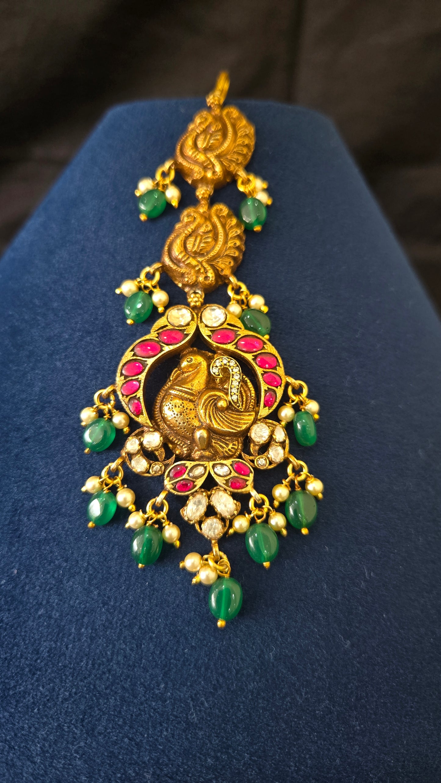 Deep Nakas Maang tikka with peacock motif