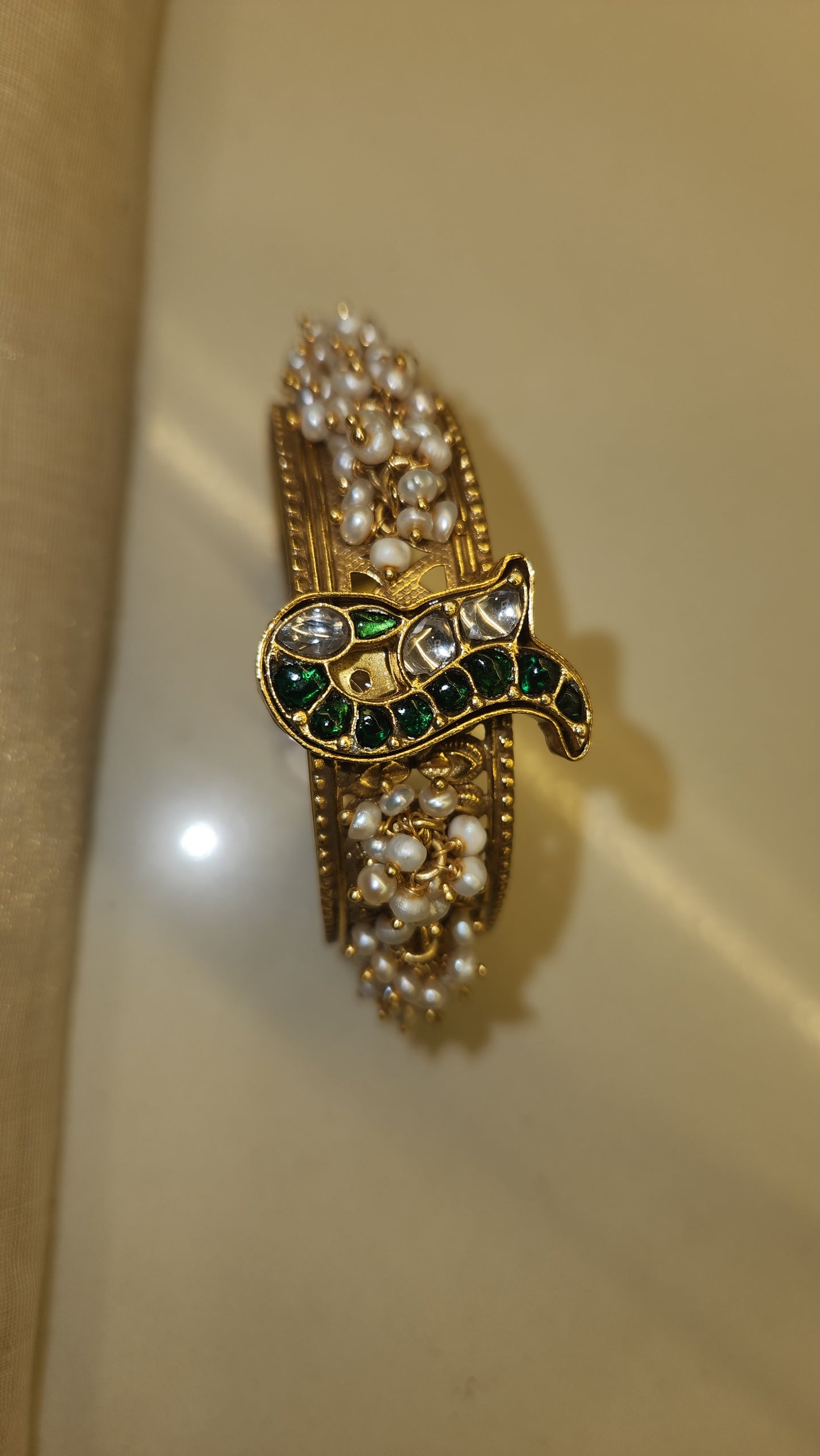 Contemporary pearl and kundan bangle